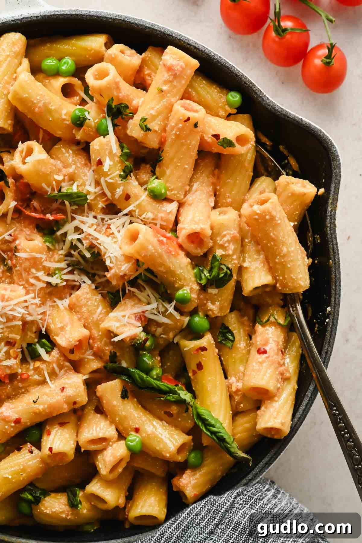 Creamy Spicy Cottage Cheese Pasta with Tomatoes and Peas 2 Finished spicy cottage cheese pasta with rigatoni, tomatoes, peas, Parmesan, and basil