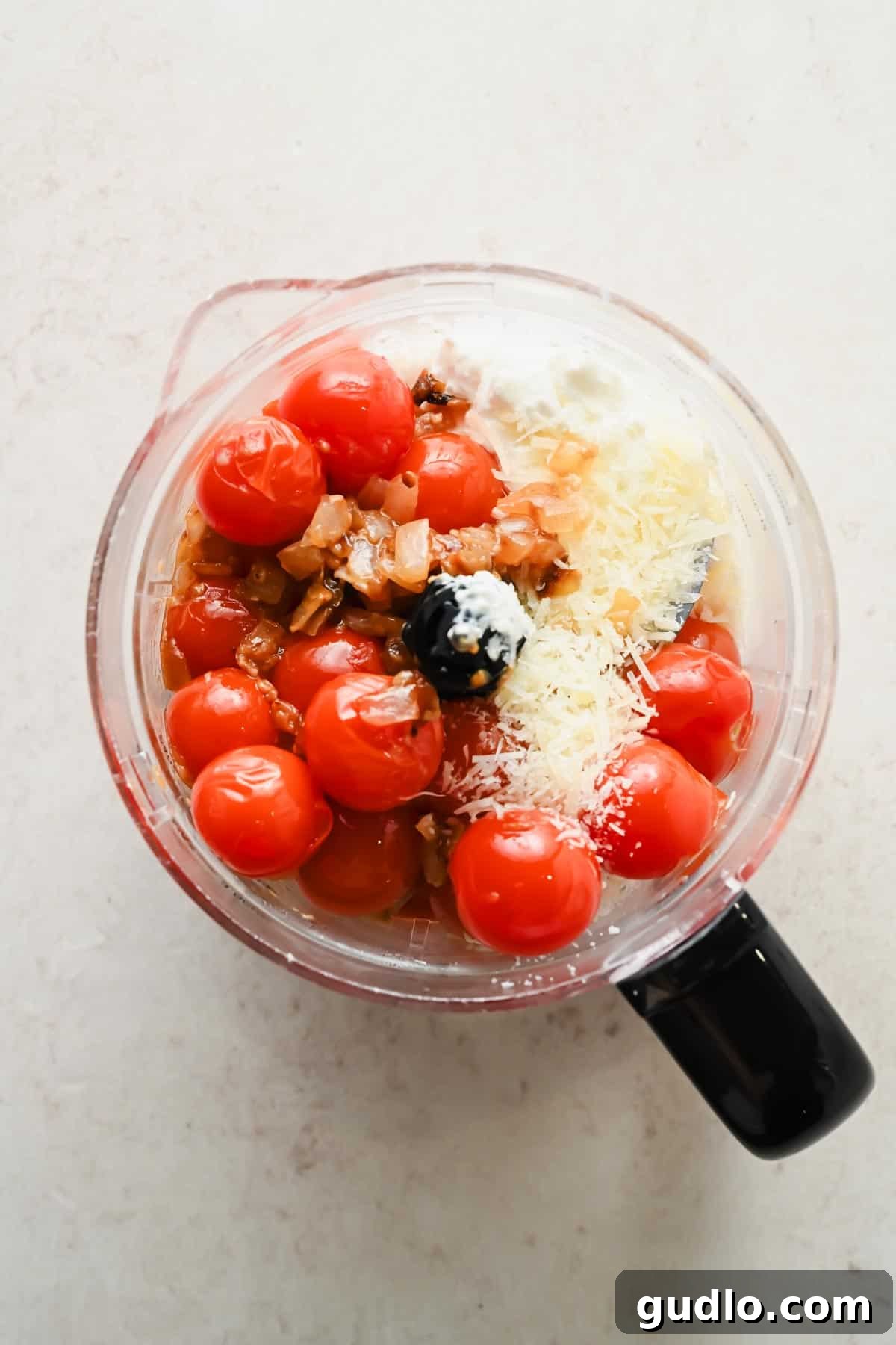 Creamy Spicy Cottage Cheese Pasta with Tomatoes and Peas 4 Tomatoes, cottage cheese, Parmesan, and red pepper flakes in a food processor