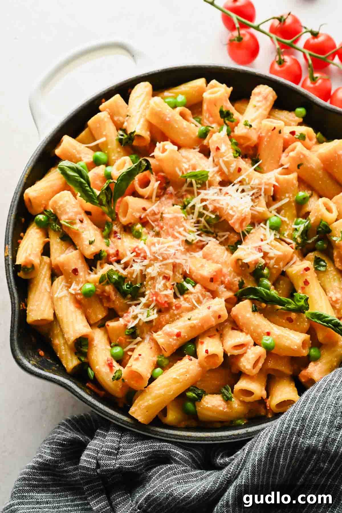 Creamy Spicy Cottage Cheese Pasta with Tomatoes and Peas 6 Creamy spicy cottage cheese pasta topped with Parmesan and basil