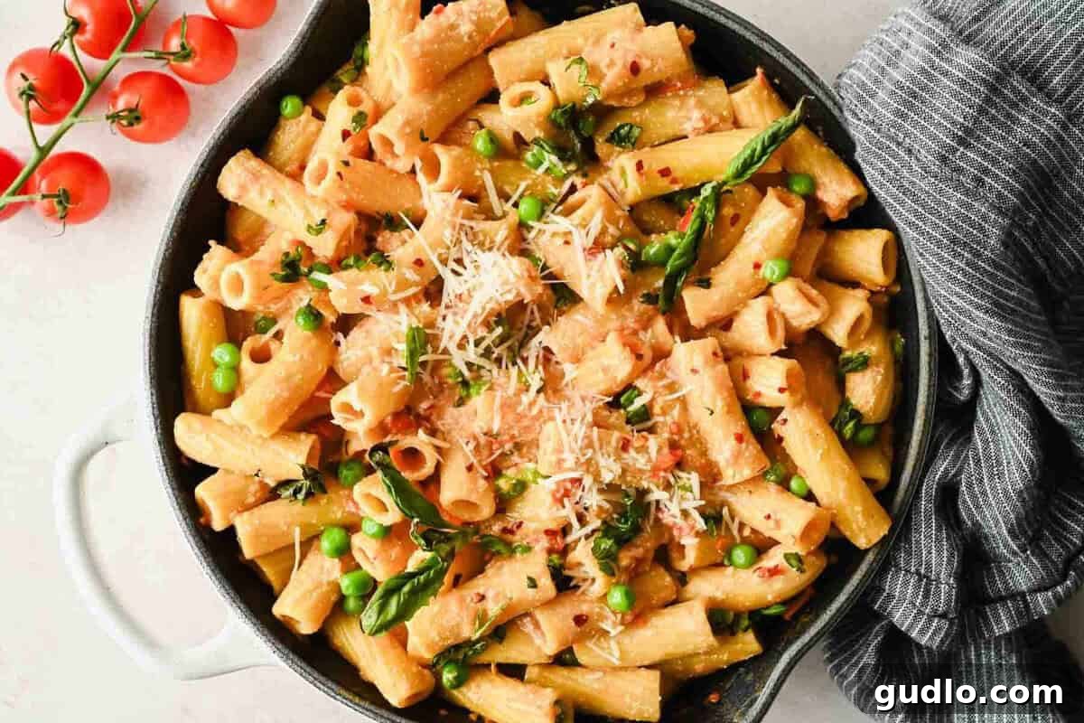 Creamy Spicy Cottage Cheese Pasta with Tomatoes and Peas 7 Spicy cottage cheese pasta with rigatoni, peas, Parmesan, and fresh basil