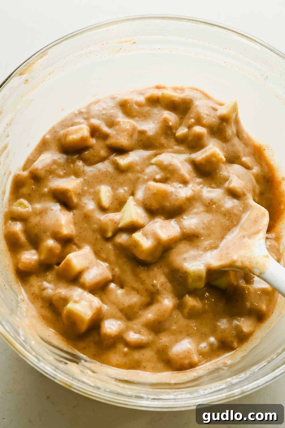 Apple Fritter Bread with Cream Cheese Swirl 4 Cinnamon apple bread batter mixed with diced Granny Smith apples